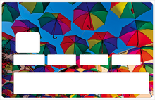 Load image into Gallery viewer, Les parapluies du soleil - Sticker pour carte bancaire, disponible en deux formats.