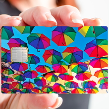 Load image into Gallery viewer, Les parapluies du soleil - Sticker pour carte bancaire, disponible en deux formats.