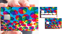Load image into Gallery viewer, Les parapluies du soleil - Sticker pour carte bancaire, disponible en deux formats.