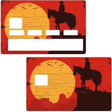 Load image into Gallery viewer, Cowboy au soleil couchant - Sticker pour carte bancaire, disponible en deux formats.
